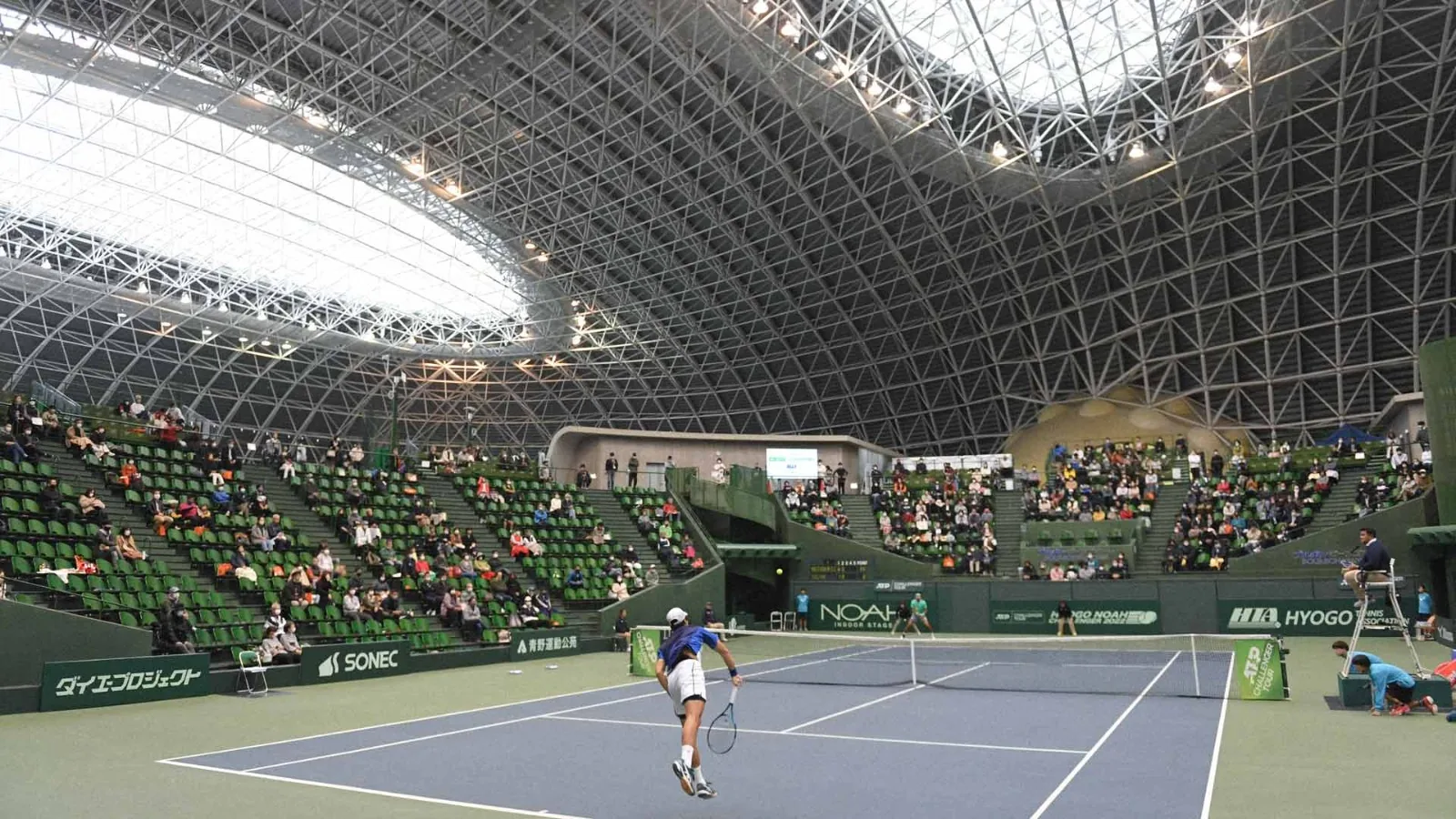 Spectators watching a tennis match on the centre court of the Bourbon Beans Dome, Miki City